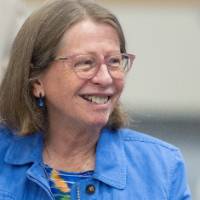 Woman smiling at someone off-camera